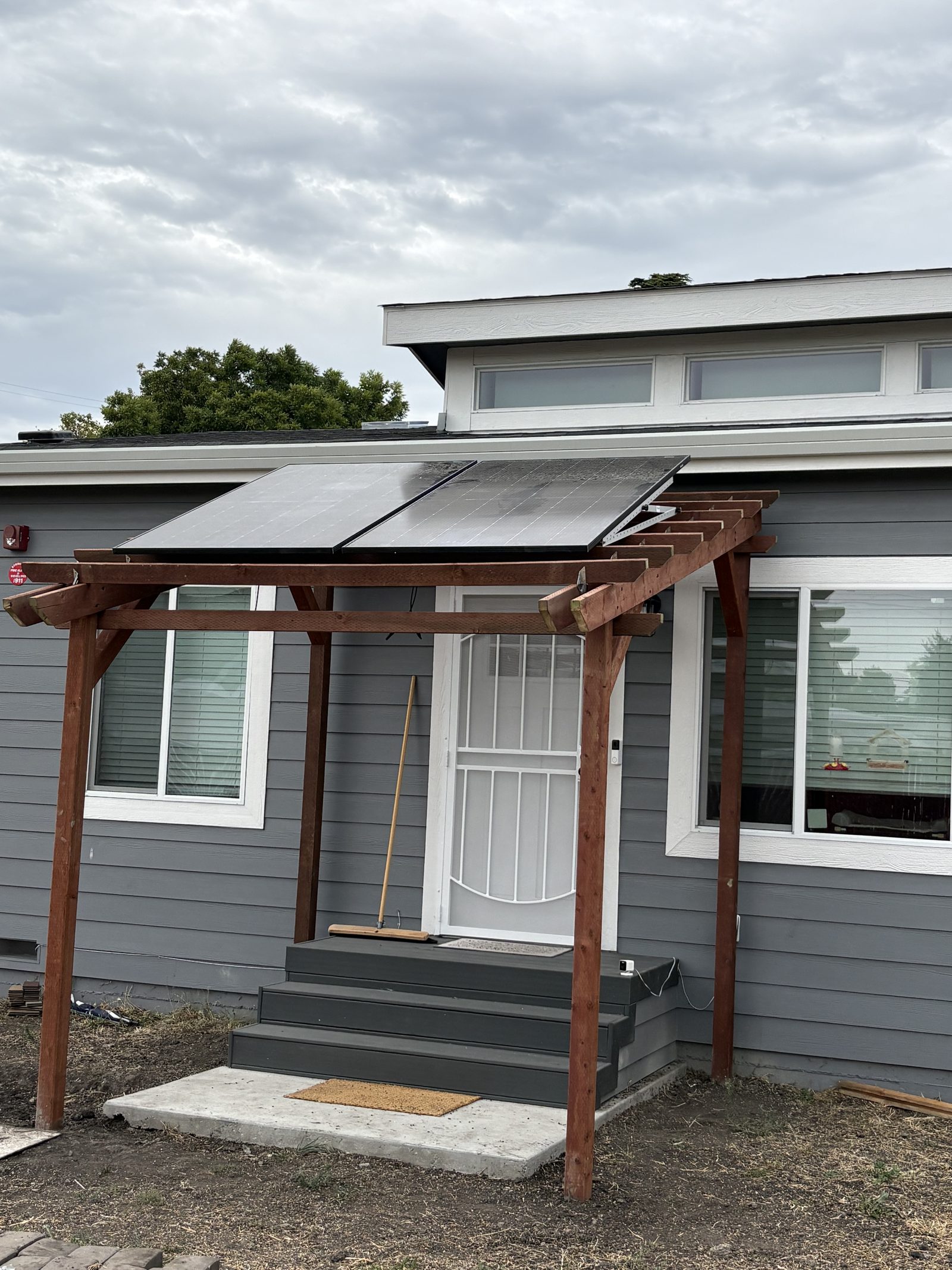 A real Astral install, Bright Saver solar panels on a custom redwood pergola